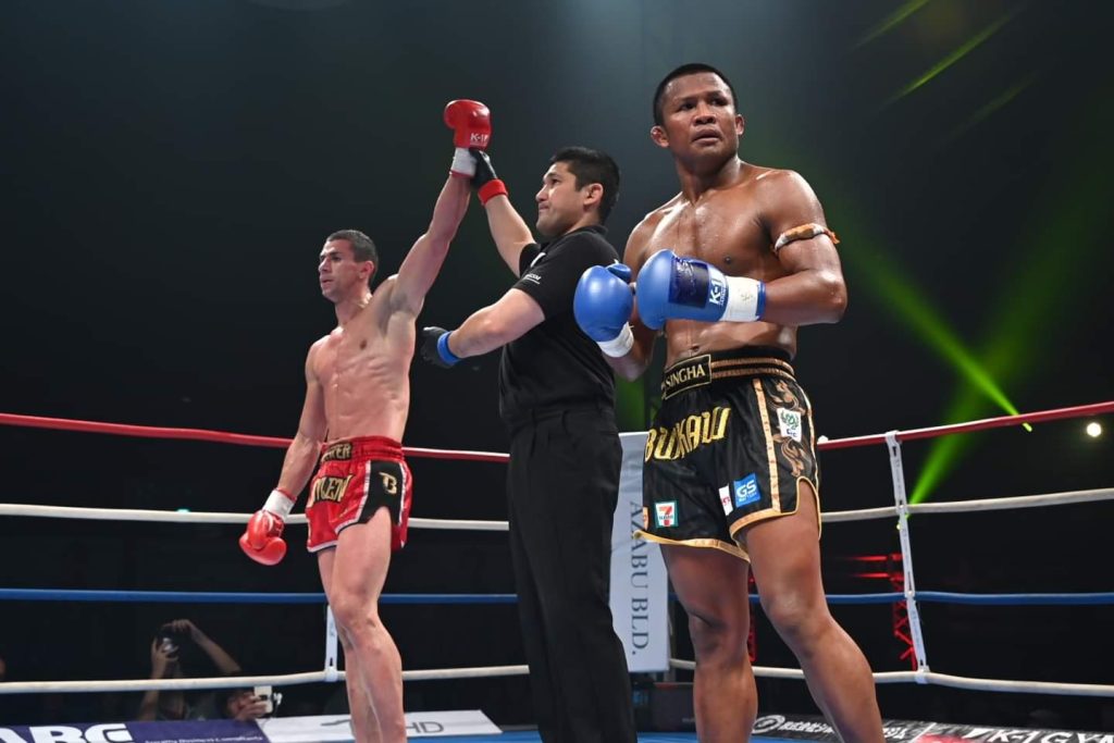 K-1 WORLD MAX 2024 Results
Tokyo, Japan 7th July 2024, Yoyogi Arena hosted K-1 WORLD MAX featuring the finals for the 70kg WGP. When former K-1 MAX Champion Buakaw accepted the wildcard to enter the tournament many wondered if the 42 year old Thai superstar could regain the K-1 title, but Stoyan Koprivlenski dropped Buakaw with a head kick to secure a points victory. Koprivlenski went on to win the tournament, knocking out Viktor Akimov in the final. The opening round of the 55kg WGP was dominated by Japanese Kickboxer’s who won all four matches.
